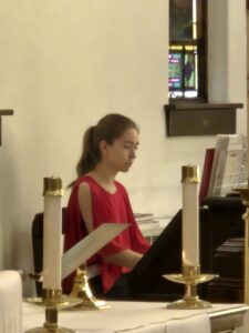 Abbie Wood playing the organ.